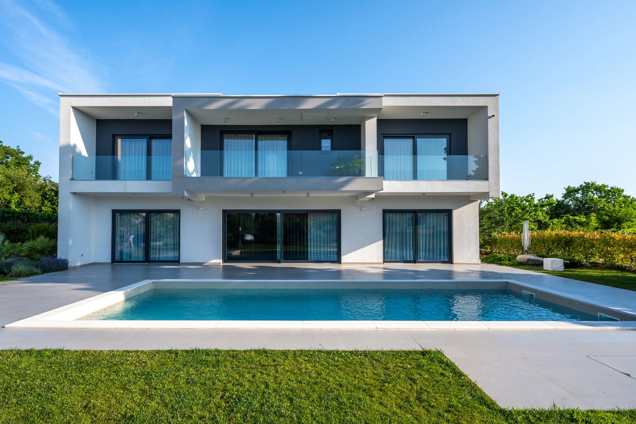 Modern home exterior with patio shade solution