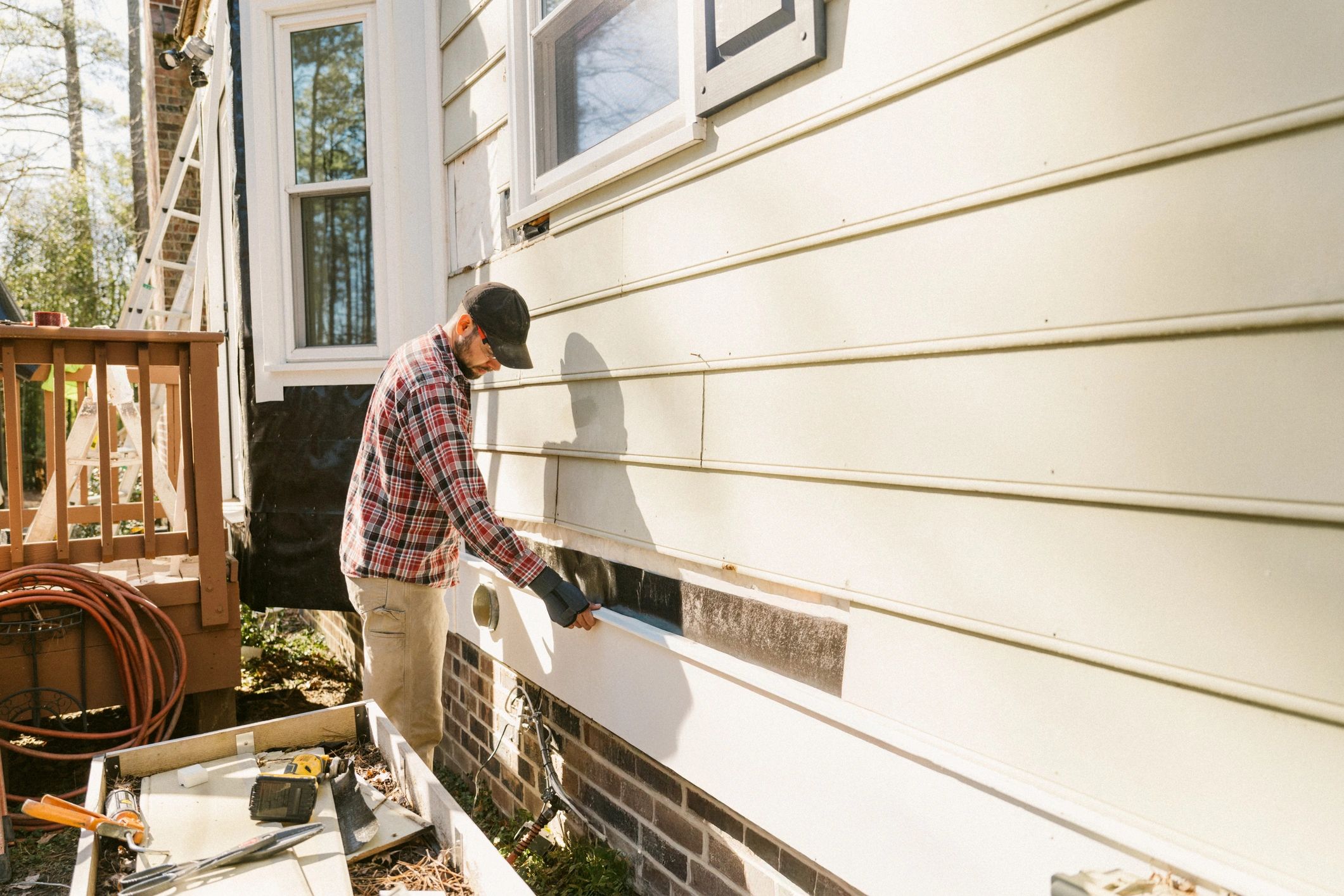 Technician performing exterior repair work